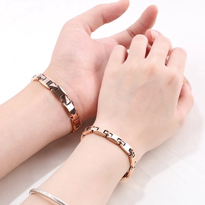 Detail of rose gold tungsten steel magnetic couples bracelets with polished geometric links