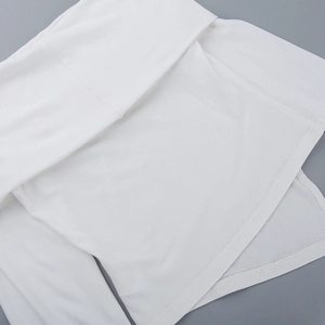 Detailed view of white ribbed knit fabric texture and high-quality stitching on a top