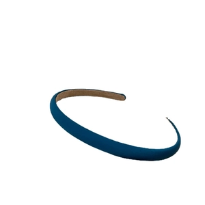 Minimalist navy blue fabric headband with slim design and soft suede texture on white background