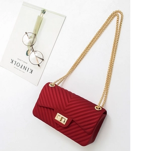 Red V-quilted jelly crossbody bag with matte finish and elegant gold chain strap