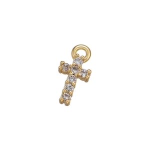 Detailed close-up of a gold cross pendant with micro-set shimmering cubic zirconia