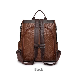 Detail view of dark brown woven PU leather backpack showing back pocket and adjustable straps