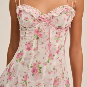 Floral print summer slip dress with lace trim and sweet pink bow details