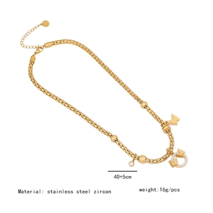 Golden stainless steel necklace featuring butterfly and zircon ring charms with braided chain