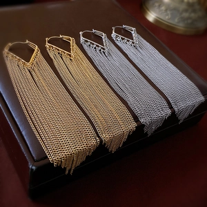 Chic long chain tassel drop earrings in gold and silver finish with metallic shine