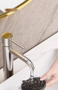 Close-up of black suction cup hook being rinsed under water to show easy cleaning feature
