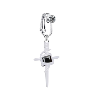Macro detail of silver cross navel clip featuring black square gem and white rhinestones