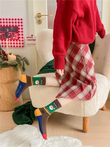 Detailed view of festive Christmas cotton socks with knit patterns in a cozy gift box set