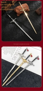 Macro detail of sword-shaped hairpins with red crystal charms and polished metal finish