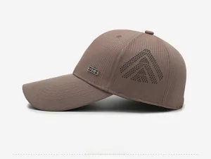 Detail of brown breathable baseball cap with laser-cut perforations and metal Sports logo