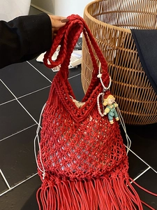 Handcrafted red cotton rope woven tote bag with tassels and cute cartoon charm