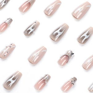 Long coffin fake nails with nude flame patterns, silver stars and chain rhinestone accents