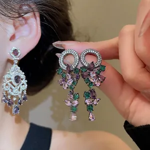 Elegant vintage chandelier earrings with purple water drop gems and cubic zirconia stones