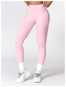 Detail of high-waisted pink yoga pants showing premium seamless fabric and butt-lifting fit
