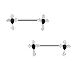 Macro detail of stainless steel nipple rings featuring black stone cross decorations