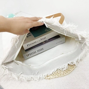 Top view of cream canvas tote bag zipper opening showing spacious interior capacity