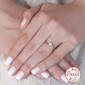 Luxurious 925 sterling silver gold-plated ring with zircon stone worn by a model