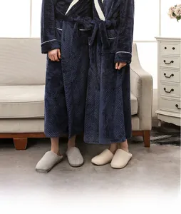 Detailed texture of thick navy flannel bathrobe with pineapple grid pattern in home setting
