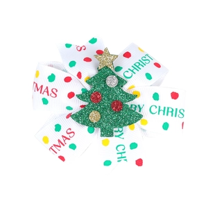 Christmas hair clip with green glitter tree and Merry Christmas printed ribbon bow