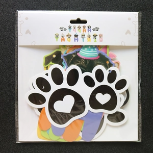 Packaged pet birthday party banner set with paw prints, bones and Happy Birthday cards