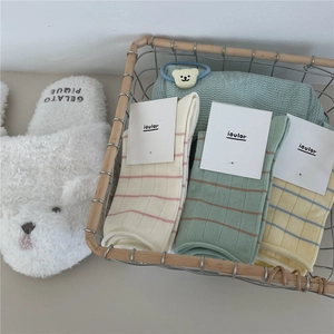 Detailed texture of Morandi color striped socks with waffle knit and rolled edge design