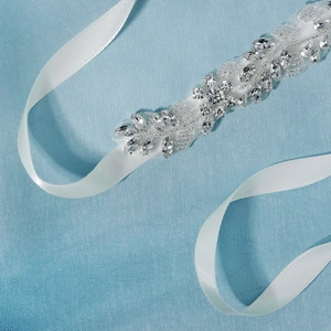 Elegant bridal sash with white satin ribbon, clear crystals and sparkling pearl appliques