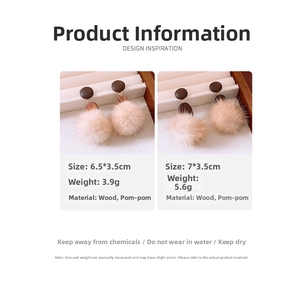 Detailed view of wood beads and faux fur pompom earrings with size specifications