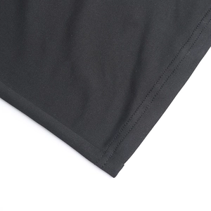 Detailed close-up of double-needle stitching and fabric texture on a black summer dress