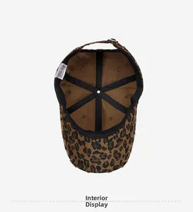 Interior view of leopard print baseball cap featuring 100% cotton label and black lining