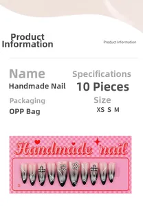 Détails de faux ongles faits main dégradé noir avec croix et accents de strass brillants
