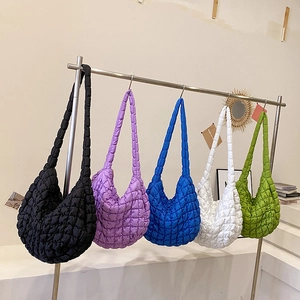 Minimalist quilted cloud tote bag in five vibrant colors with a soft textured finish