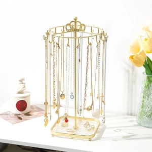 Golden crown jewelry stand with rotating hooks and square base tray for home storage