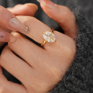 Detailed close-up of 18k gold plated oval-cut zircon ring with elegant four-prong setting