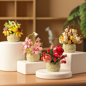 Set of four micro building block flower bouquets in woven baskets on wooden stand