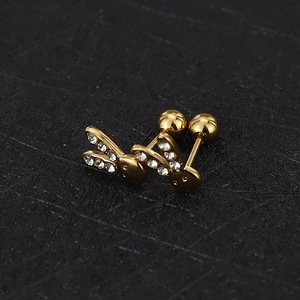 Macro detail of golden rabbit screw back earrings with sparkling zircon crystals