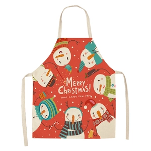 Close-up of red Christmas apron with festive snowman and Merry Christmas text