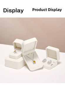 Luxurious velvet jewelry gift boxes showcasing a yellow gemstone ring and necklace set