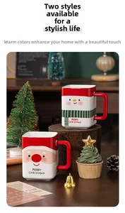 Close-up of ceramic Santa and Snowman square mugs with festive Merry Christmas lettering