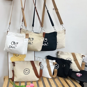 Minimalist canvas messenger bag with cartoon smile design in multi-color options