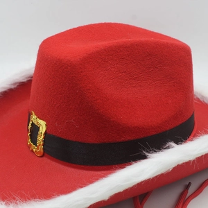 Macro detail of Christmas red cowboy hat with white faux fur trim and gold buckle belt