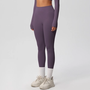 Detail view of high-waisted dark purple yoga leggings with soft brushed fabric texture