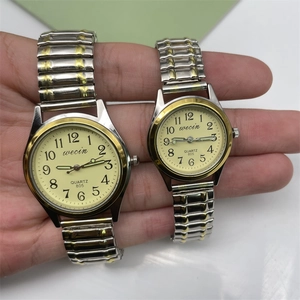 Luminous quartz watch pair with elastic steel band and large Arabic numerals