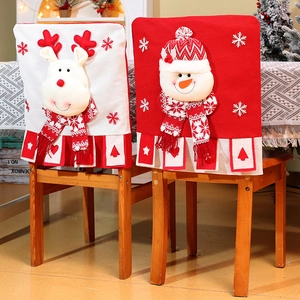 Close-up of 3D knitted Christmas chair covers with snowman and reindeer designs