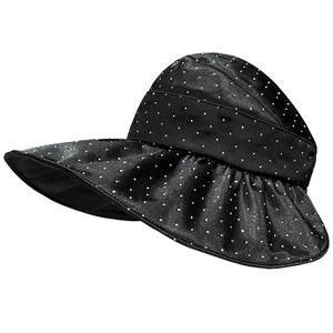 Stylish black polka dot sun visor with wide brim and silky finish on white background