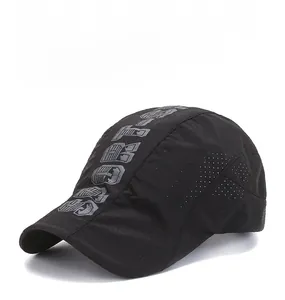 Detail of black mesh sun hat featuring breathable fabric and urban artistic lettering