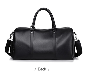 Back view of black lychee texture travel bag with adjustable strap and handles