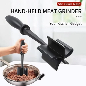 Close-up of hand-held meat chopper grinding ground meat in a skillet with text overlay