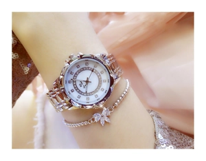 Close-up of BS Bee Sister silver watch and bow bracelet set on a female wrist
