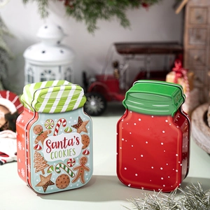 Festive Santa’s Cookies tin jars with gingerbread patterns for Christmas party decor