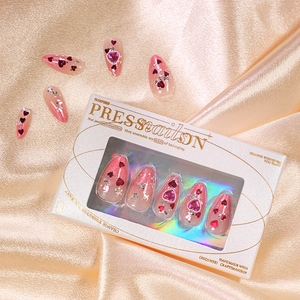 Pink gradient press-on nails with heart gems and silver glitter in elegant white gift box